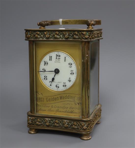 A cased brass carriage timepiece